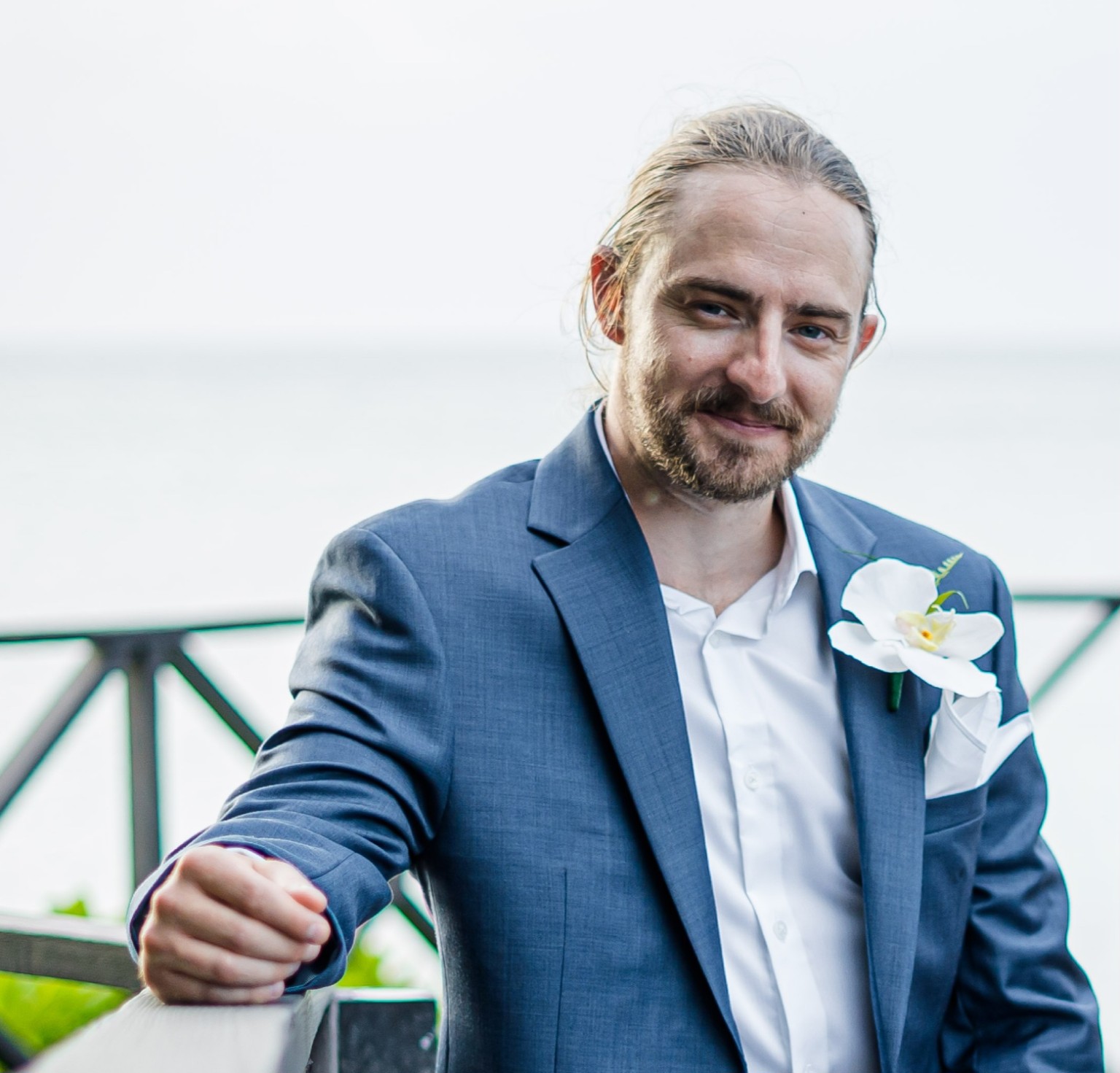 Andrew Price, OD, wearing a blue suit